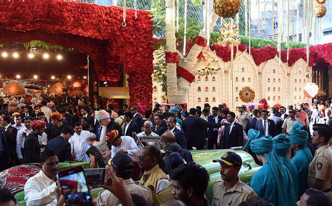 The entire street was decorated with elaborate floral arrangement in anticipation of the event and crowds of residents turned out to line road and watch the arrivals